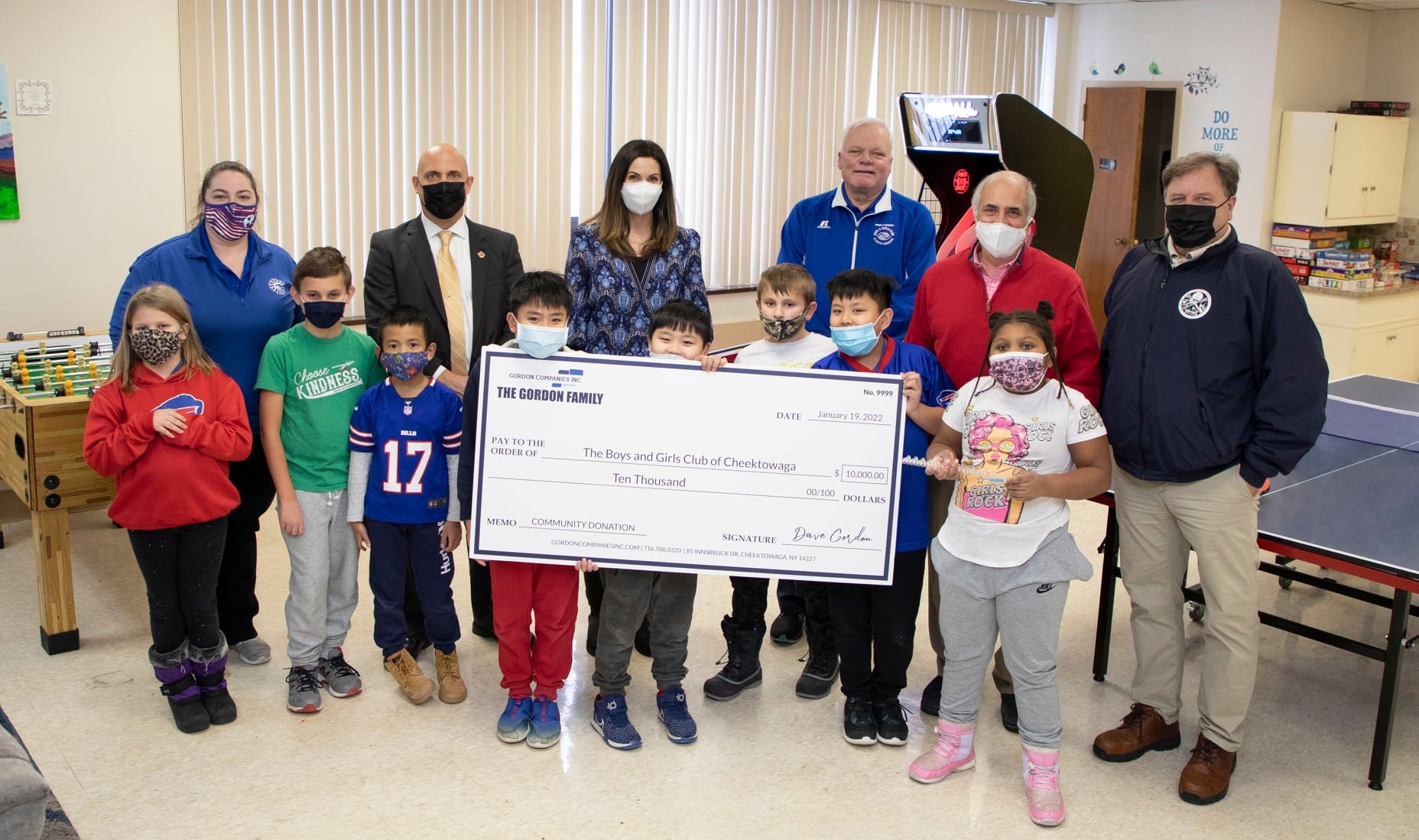 CEO Dave Gordon and Director of Communications Laura Gordon present a check to the Cheektowaga Boys & Girls Club.